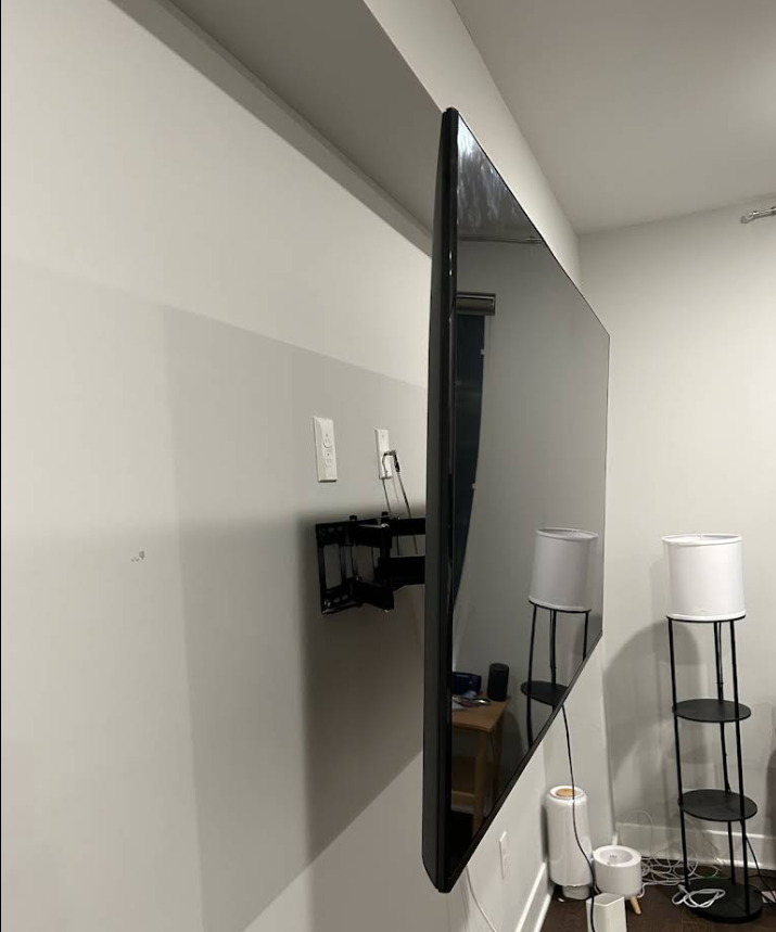 Side view of TV on articulating wall mount bracket